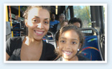 Mother and Daughter sitting on bus